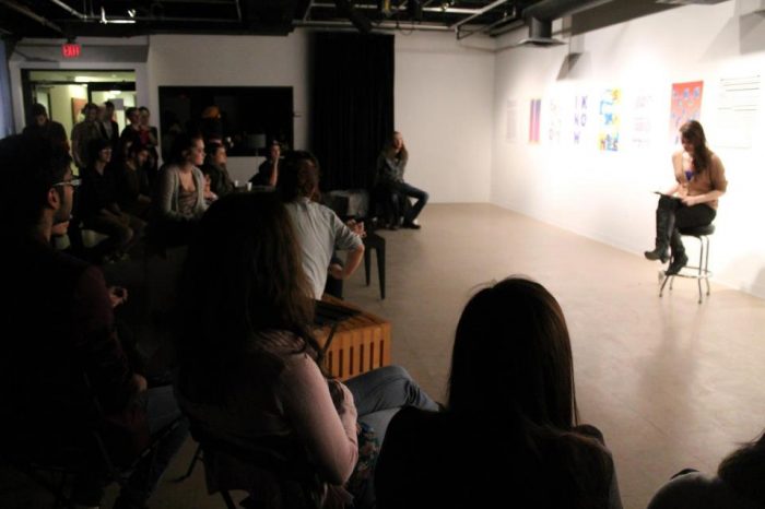 Rachel Kennedy reading at one of Winters' College's poetry nights at EWAG (Eleanore Winters Art Gallery)