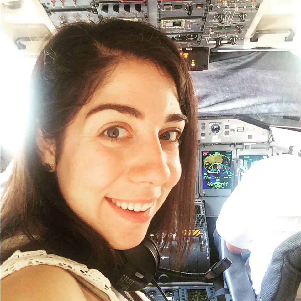 Adriana Dmitri in the cockpit of a Porter Airlines plane